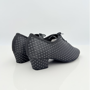Eva art. 312 Nicole Rimini vista laterale tessuto Celebrity bicolore nero argento tomaia morbida lacci cotone mod 2cal tacco latino 4 cm mod 4hlt ultra flessibile pianta larga allenamento pratica caraibico tango
