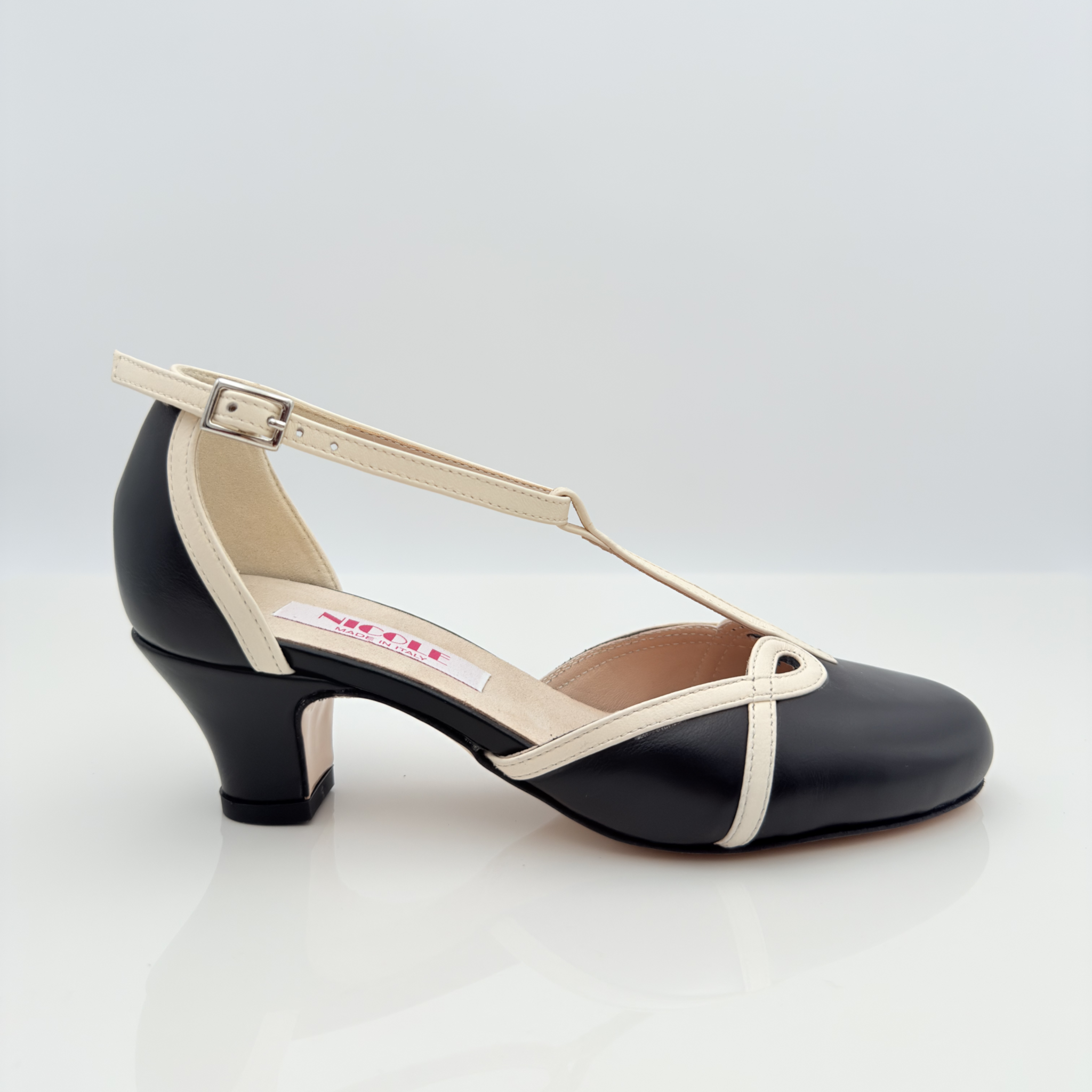 Karen art. 406 Nicole Rimini scarpa swing donna pelle nera panna bicolore cinturino semplice 2CAB tacco swing 4HSW punta chiusa F5P4 suola cuoio stile retrò anni 50 made in Italy
