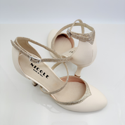 Dettaglio cinturino incrociato Mod. 1CAI Marisol art. 206 pelle panna glitter fine nude punta chiusa F5P3 tacco rocchetto 9HR scarpa cerimonia Nicole Rimini made in Italy
