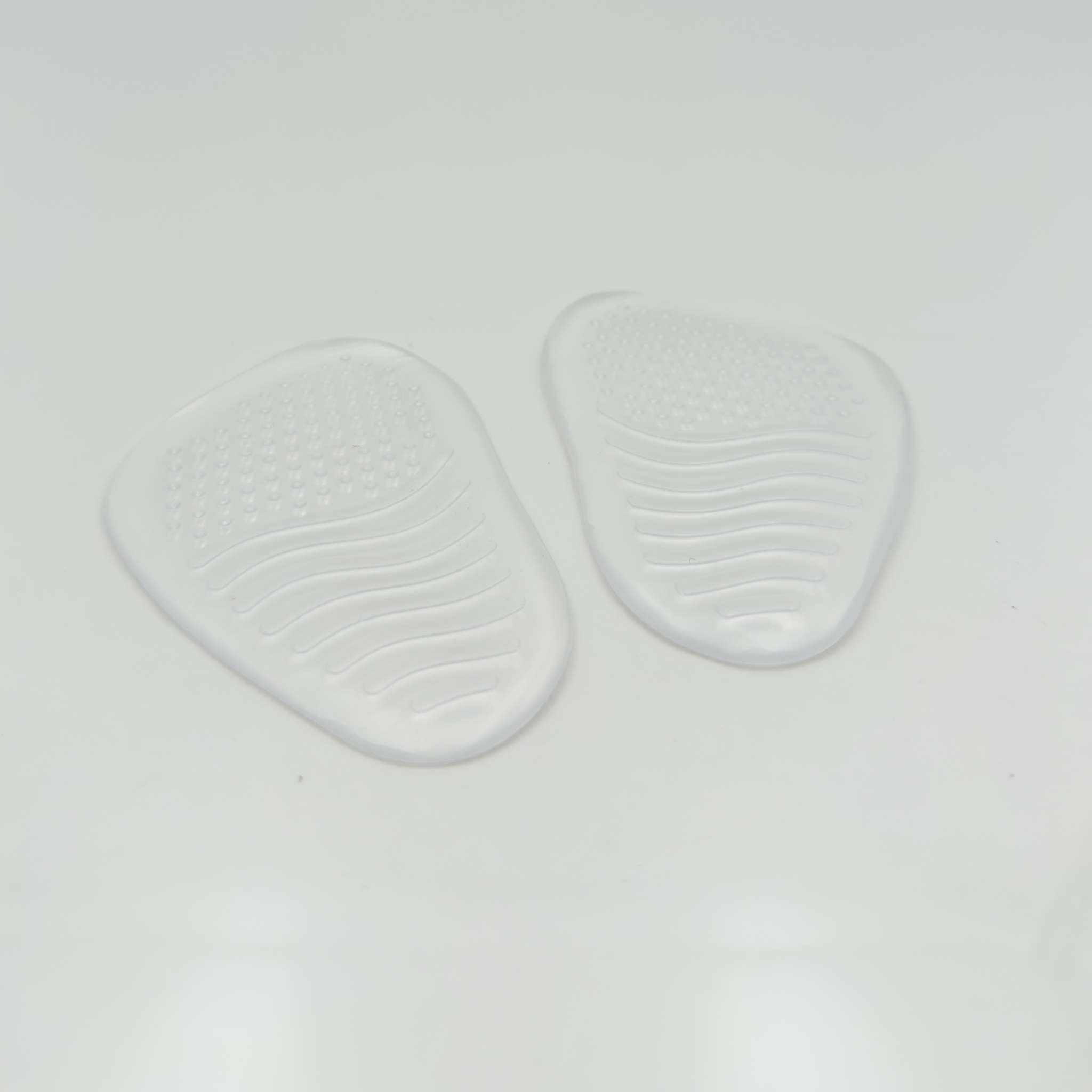 Mezza Piantina in Silicone Nicole Rimini posizionata nella parte anteriore della scarpa da ballo — riduce scivolamento piede magro, ammortizzazione metatarso, accessori danza made in Italy
