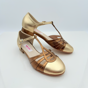 Vista laterale Perl art. 413 Nicole Rimini pelle laminata oro bronzo bicolore tacco basso quadrato 1,5 cm cinturino caviglia 1CAB punta chiusa F5P3 suola cuoio pomiciato scarpa swing donna


