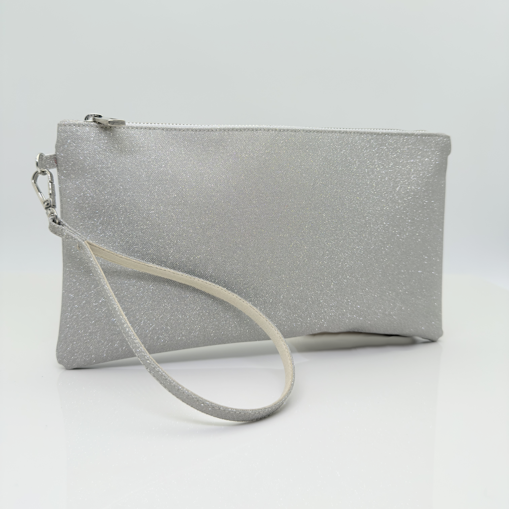 Pochette Microglitter Platino Nicole Rimini con zip e braccialetto coordinato — pochette elegante donna cerimonia fodera raso cuciture rinforzate accessori made in Italy Nicole Rimini
